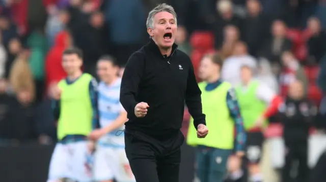 Phil Parkinson celebrating a win