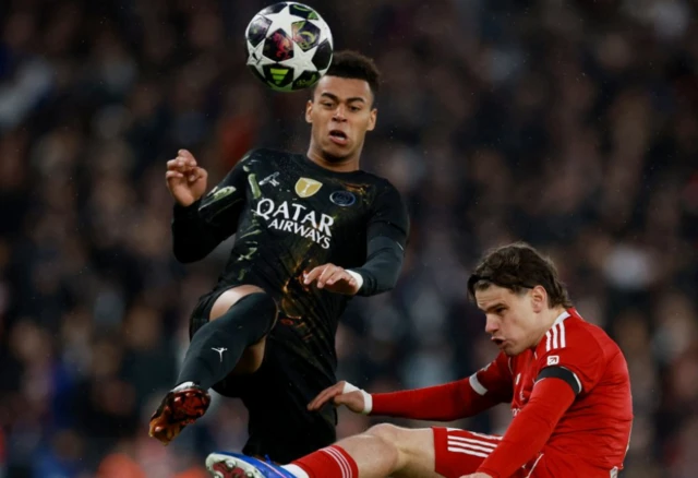 Paris St Germain's Desire Doue in action with Liverpool's Milos Kerkez