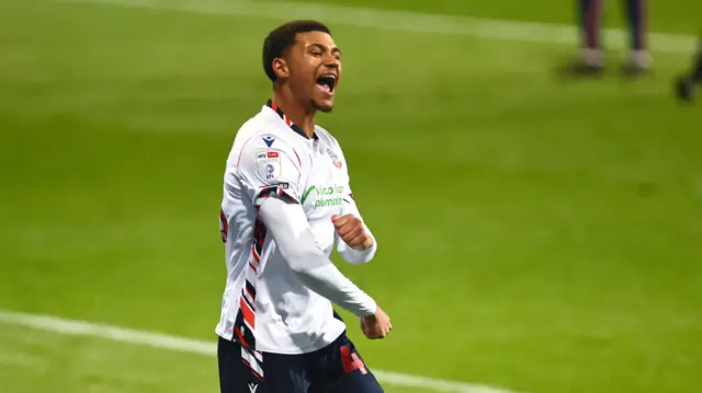 Mason Burstow celebrates scoring Bolton's fifth goal against Stevenage