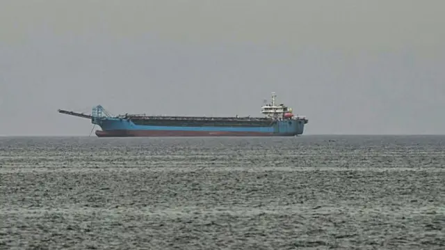 A ship is seen off the coast of Sharjah