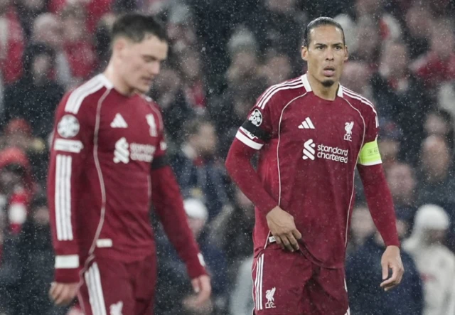 Liverpool's Virgil van Dijk looks dejected after Paris Saint-Germain's Ousmane Dembele scored