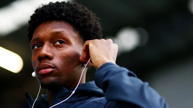Ipswich winger Jaden Philogene adjusts his headphones at Fratton Park