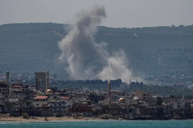 Smoke rises following an Israeli strike at Qlaileh