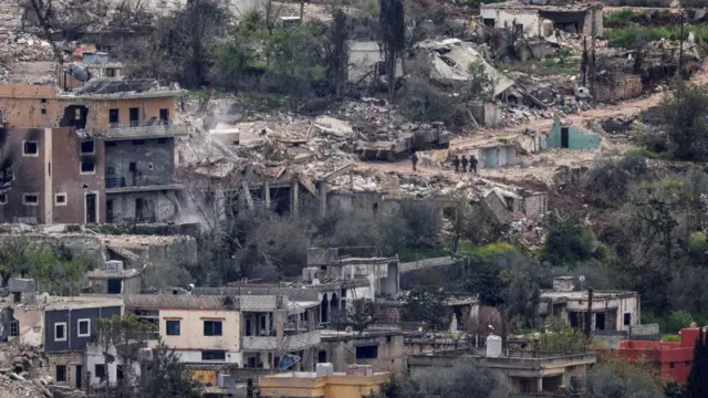 Destroyed buildings on a hill in southern Lebanon