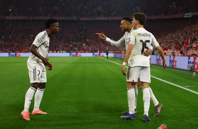 Real Madrid's Kylian Mbappe celebrates scoring their third goal with Vinicius Junior and Arda Guler