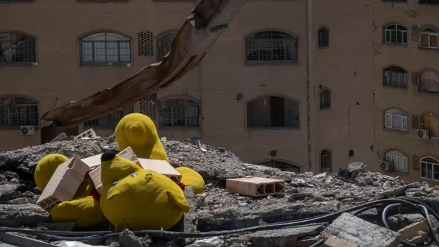 A teddy bear pictured under the ruins of a building in the Shahid Boroujerdi residential complex in southern Tehran yesterday. The building was destroyed in US-Israel attacks on 4 March