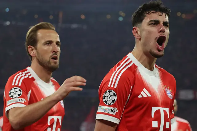 Bayern Munich's German midfielder #45 Aleksandar Pavlovic (R) celebrates after scoring