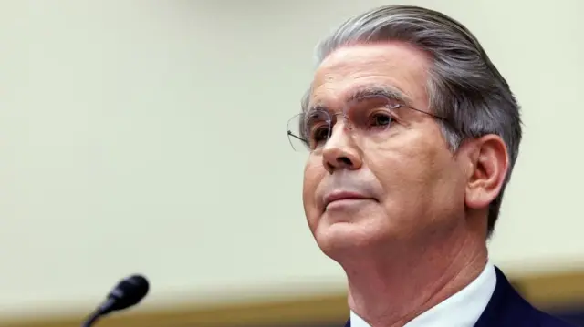 Scott Bessent stands at a podium