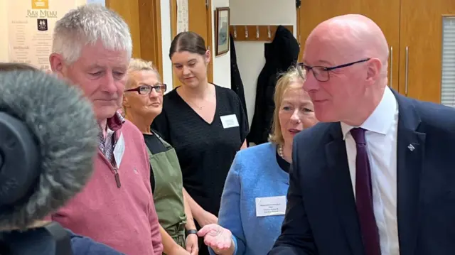 SNP leader John Swinney visits the Carrick Community Centre in Maybole, greeted by staff and volunteers.