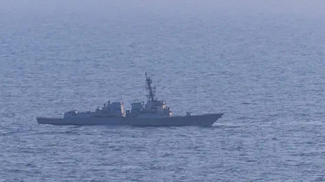 Image of US destroyer the USS Spruance pictured in the ocean from a fair distance away