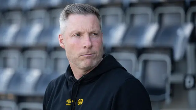 Neil Harris on the touchline