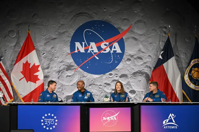 (L-R) NASA's Artemis II mission astronauts, commander Reid Wiseman, Victor Glover, Christina Koch and Canadian Space Agency's Jeremy Hansen attend a press conference at Johnson Space Center in Houston, Texas, on April 16, 2026. The astronauts did the first slingshot around the Moon in more than 50 years and traveled deeper into space than any humans before, culminating in a smooth splashdown on April 10 off the coast of California.
