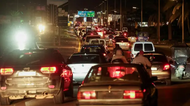line of cars on the freeway at night