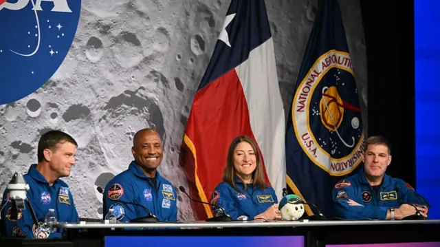 (L-R) NASA's Artemis II mission astronauts, commander Reid Wiseman, Victor Glover, Christina Koch and Canadian Space Agency's Jeremy Hansen attend a press conference at Johnson Space Center in Houston,