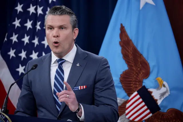 US Defence Secretary Pete Hegseth pointing with one finger while delivering a press conference