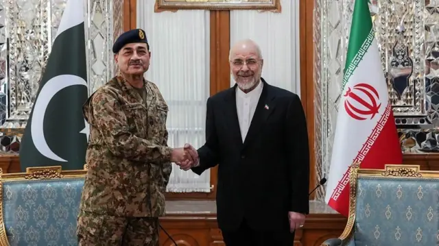 Iranian Parliament Speaker Mohammad Bagher Ghalibaf (R) meeting with Pakistan army chief Asim Munir in Tehran
