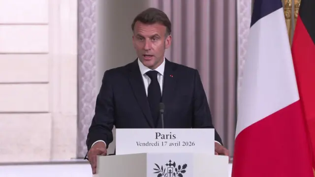 Macron speaking at news conference