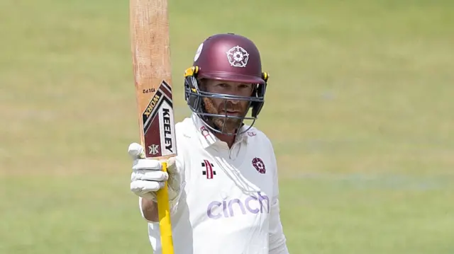 Luke Procter raises his bat