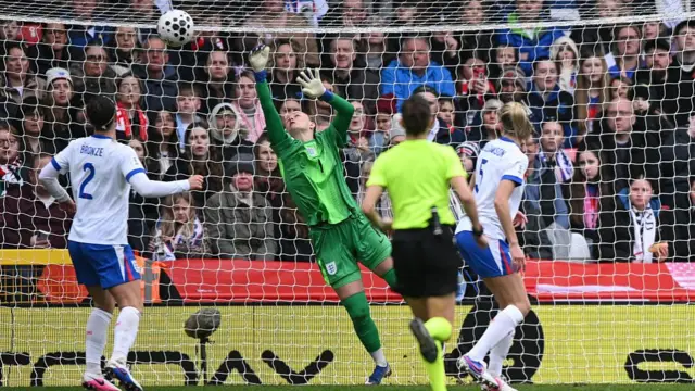 Hannah Hampton makes a save