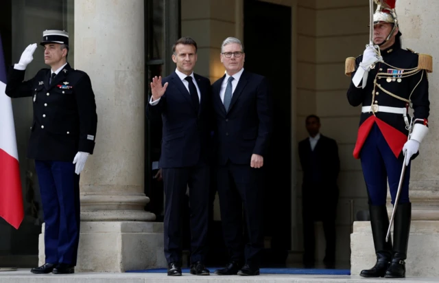 French President Emmanuel Macron welcomes Britain's Prime Minister Keir Starmer for a lunch meeting at the Elysee Palace