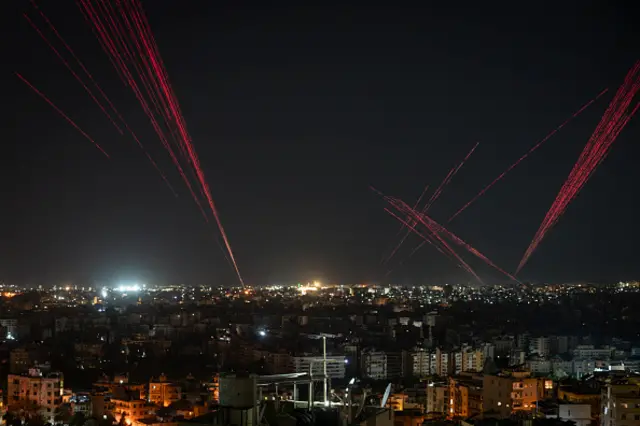 Citizens in the city fire bullets into the sky to celebrate the ceasefire agreement