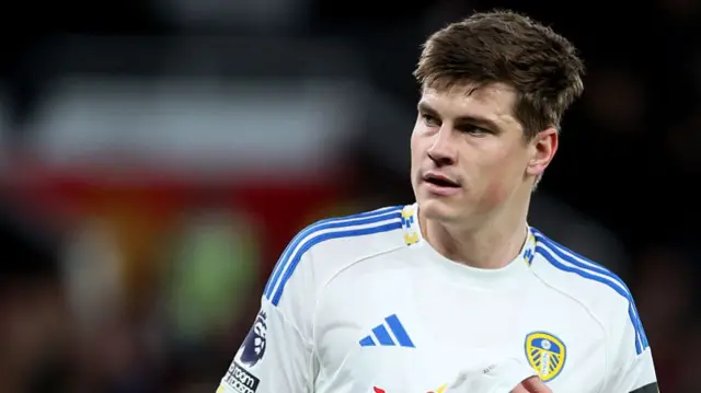 Bijol of Leeds in a white jersey with blue Adidas details