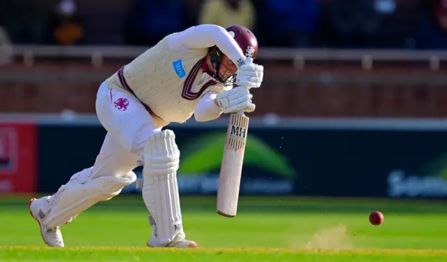 James Rew batting the ball away