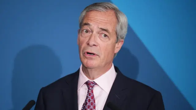 Headshot of Farage who speaks in front of a blue background