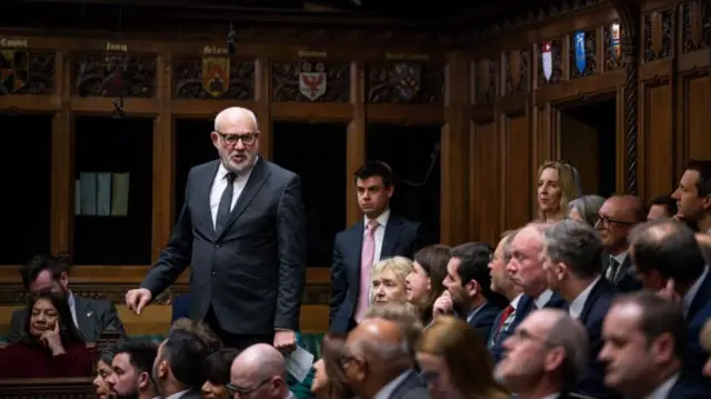 Jon Trickett stands up on the benches of the House of Commons