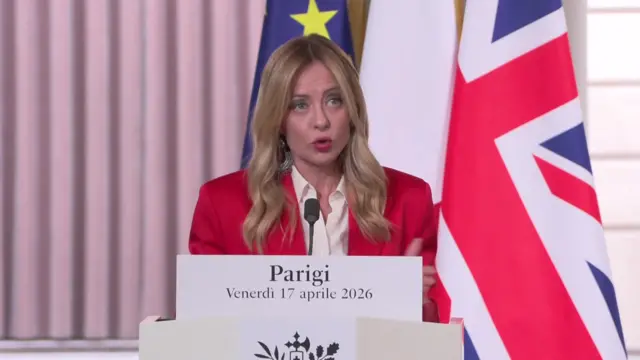 Meloni speaking at news conference