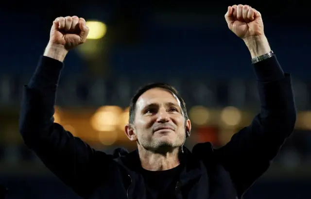 Frank Lampard raises both arms in celebration at Ewood Park after his side's victory