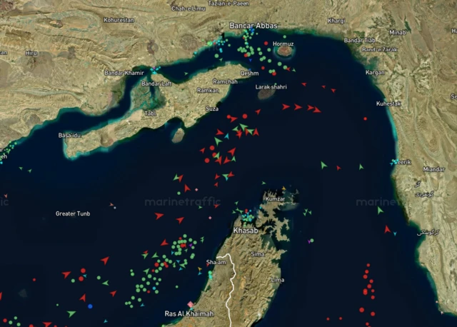 red and green arrows denoting vessels can be seen on a map of the strait.