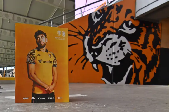 A general view inside Hull City MKM stadium showing match programme