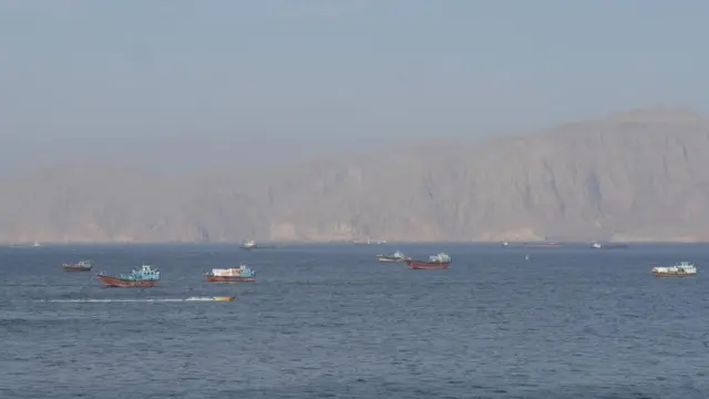 Ships and tankers in the Strait of Hormuz off the coast of Oman