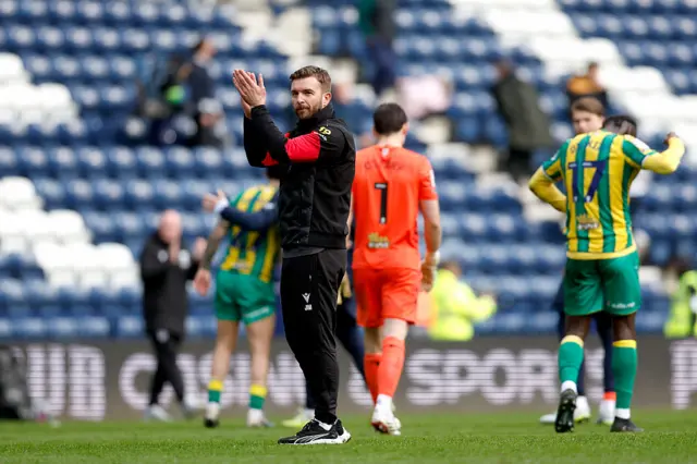 James Morrison Interim Head Coach of West Bromwich Albion celebrates with the West Bromwich Albion fans
