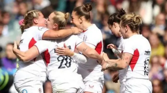 England celebrate scoring at Scotland