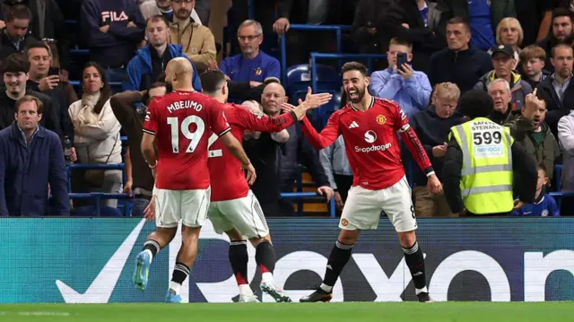 Manchester United players celebrate a goal