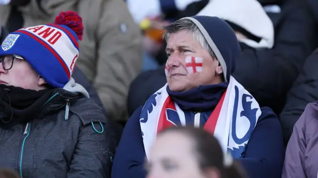 An England fan looks on