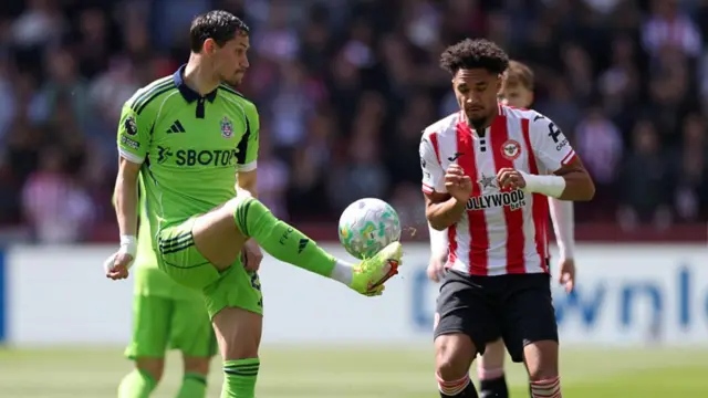 Sasa Lukic of Fulham controls the ball while under pressure from Kevin Schade