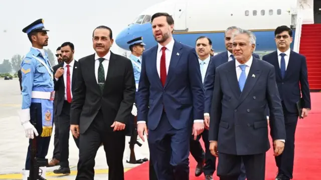 U.S. Vice President JD Vance (C) walks with Pakistan's Chief of Defence Forces and Chief of Army Staff, Field Marshal Asim Munir (L), and Pakistani Deputy Prime Minister and Foreign Minister Mohammad Ishaq Dar (R), upon arrival at the airport in Islamabad, Pakistan, 11 April 2026. An Iranian and US delegation arrived in Islamabad for planned peace talks amid a fragile two-week ceasefire following the conflict that began on 28 February 2026