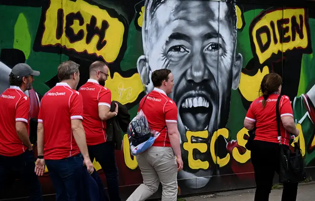 Wrexham fans arrive ahead of the Championship match between Wrexham AFC and Stoke City