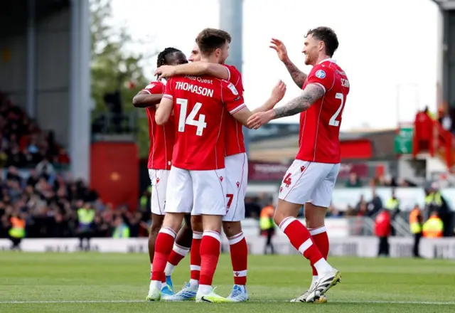 Wrexham's George Thomason (front left) celebrates