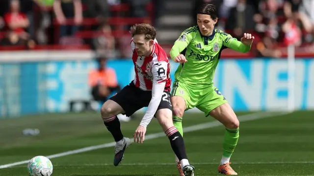 Keane Lewis-Potter of Brentford is challenged by Harry Wilson of Fulham