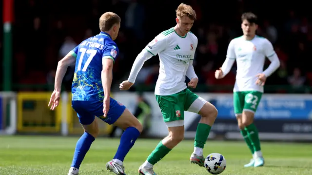 Tom Wilson-Brown wearing Swindon's white kit