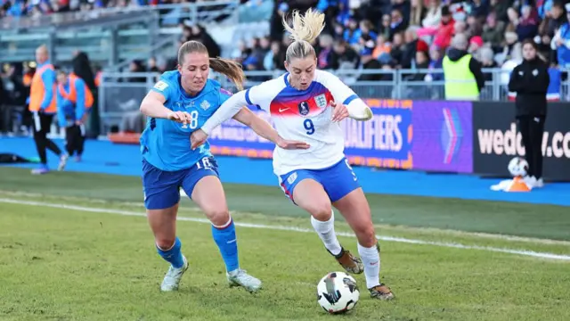 Gudrun Arnardottir of Iceland challenges Alessia Russo