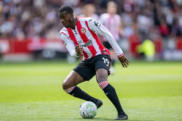 Dango Ouattara of Brentford FC controls the ball