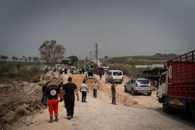 Lebanese people travel south on an improvised bridge with their belongings on April 18, 2026 in Qasmiyeh, Lebanon. At 00:00 on April 17, a 10-day ceasefire took effect that is meant to pause fighting between Israeli forces and the Lebanese militant group Hezbollah.