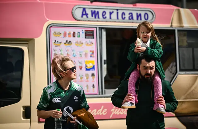 A young fan with a 99 ice cream