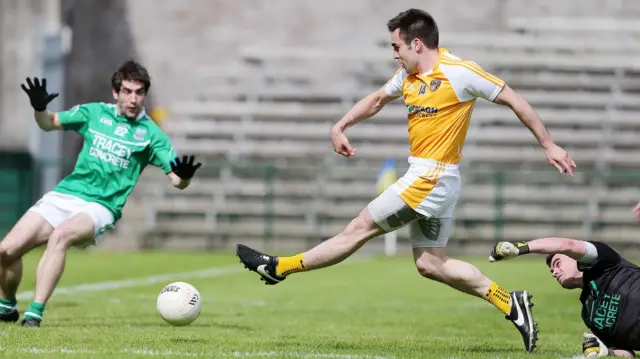 Kevin Niblock scores a goal for Antrim