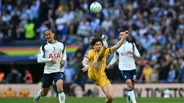 Ferdi Kadioglu clears the ball